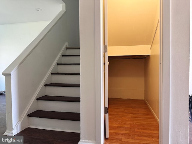 staircase featuring hardwood / wood-style floors