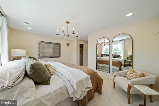 bedroom with a notable chandelier and a closet