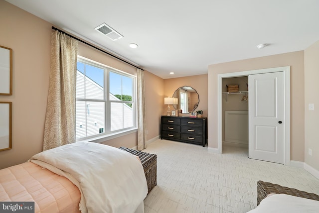 carpeted bedroom with a closet