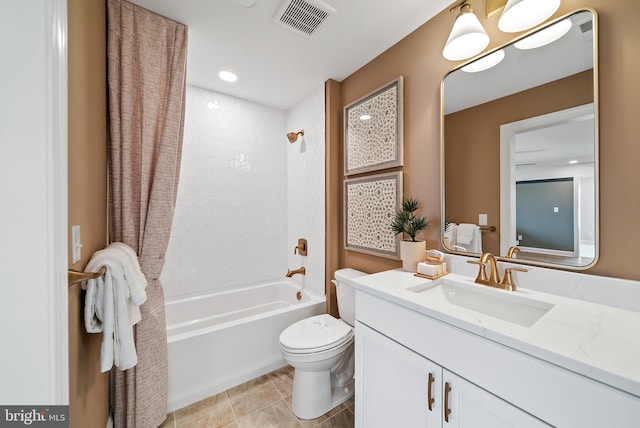 full bathroom with tile patterned floors,  shower combination, vanity, and toilet