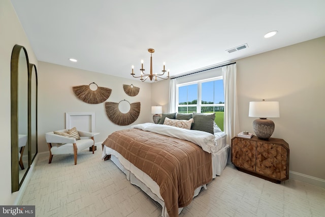 bedroom featuring a notable chandelier