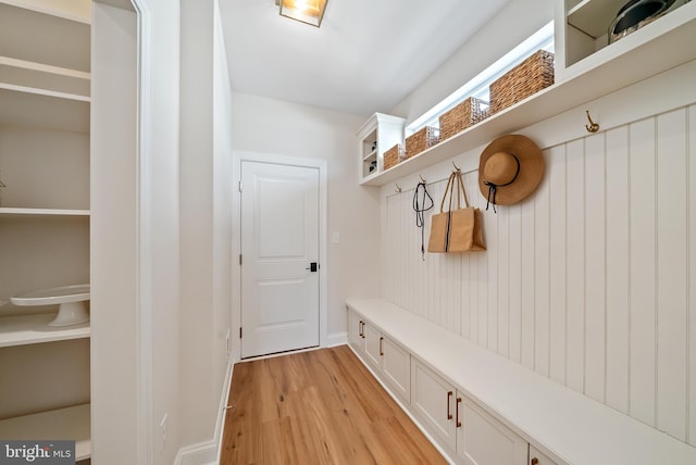 mudroom with light hardwood / wood-style flooring