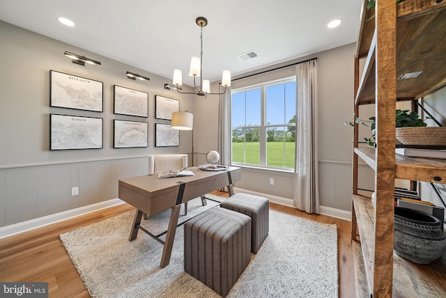 office area featuring a chandelier and hardwood / wood-style floors