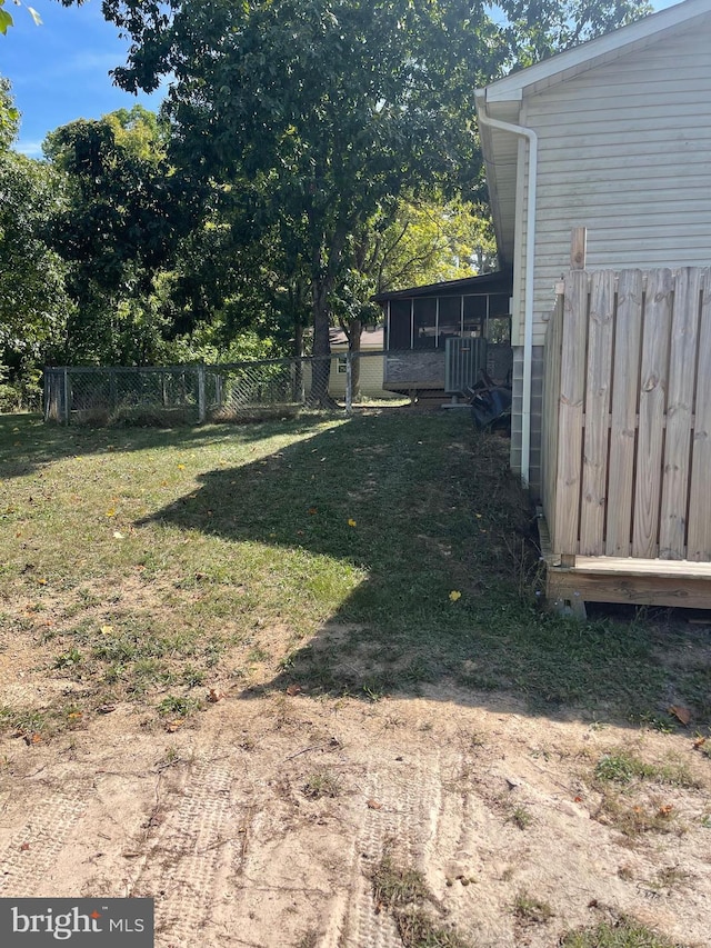 view of yard with a sunroom