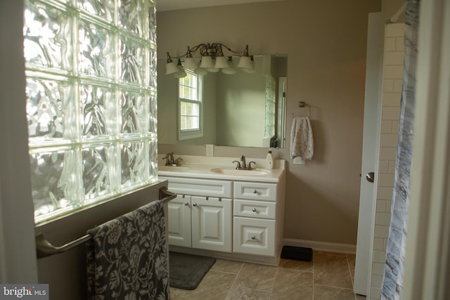 bathroom with tile patterned flooring and vanity