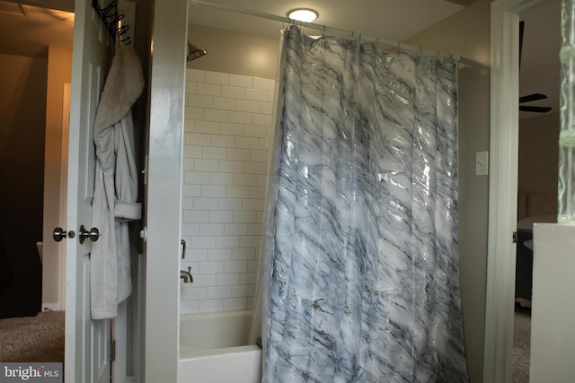 bathroom with shower / bath combo with shower curtain