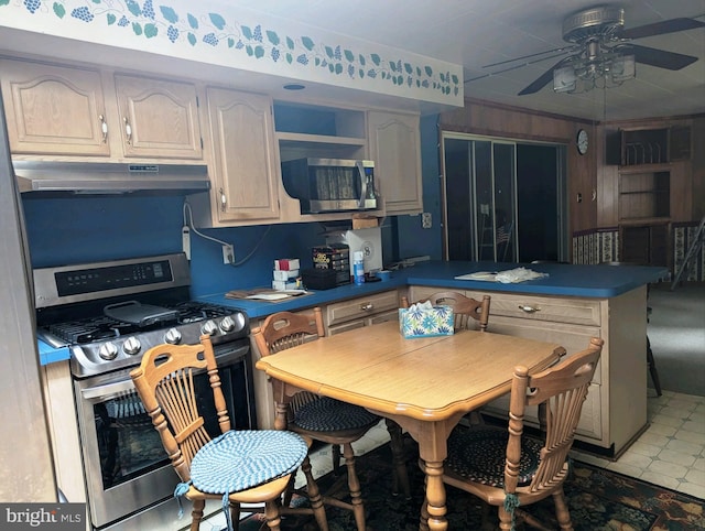 kitchen featuring ceiling fan, appliances with stainless steel finishes, and light tile patterned floors