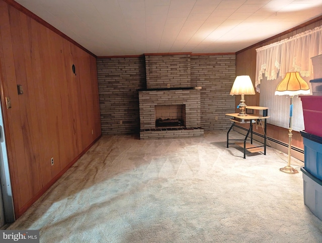 living area with ornamental molding, a fireplace, wood walls, and light carpet