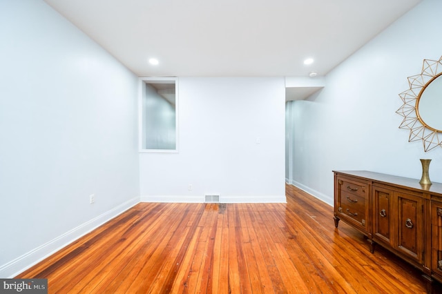 spare room featuring hardwood / wood-style flooring