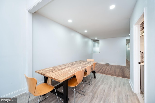 dining space with light wood-type flooring