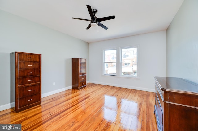 unfurnished bedroom with ceiling fan and light wood-type flooring