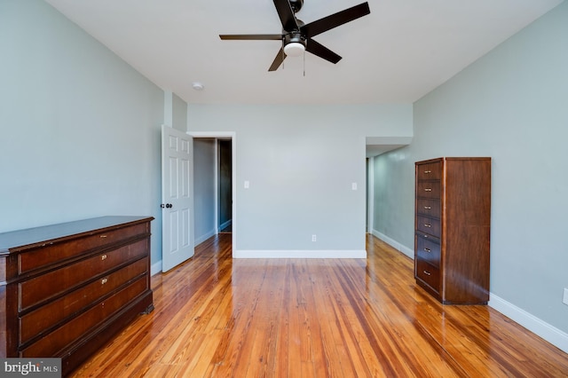 unfurnished bedroom with light wood-type flooring and ceiling fan