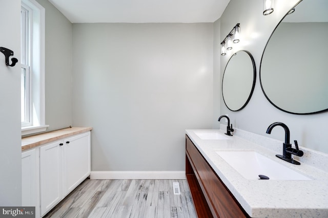 bathroom featuring vanity and hardwood / wood-style flooring