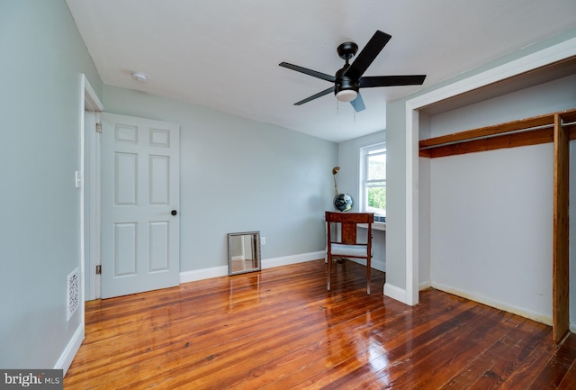 bedroom featuring dark hardwood / wood-style floors and ceiling fan