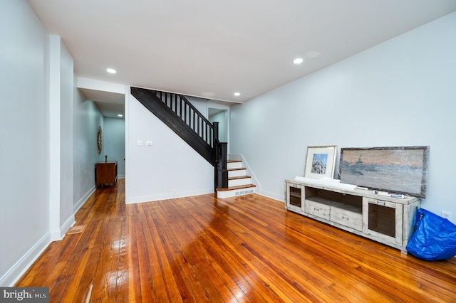 unfurnished living room featuring hardwood / wood-style floors