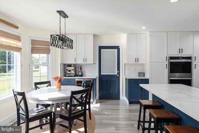 dining area with light hardwood / wood-style floors