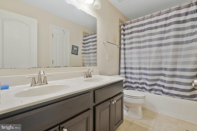 full bathroom featuring shower / tub combo, tile patterned flooring, vanity, and toilet