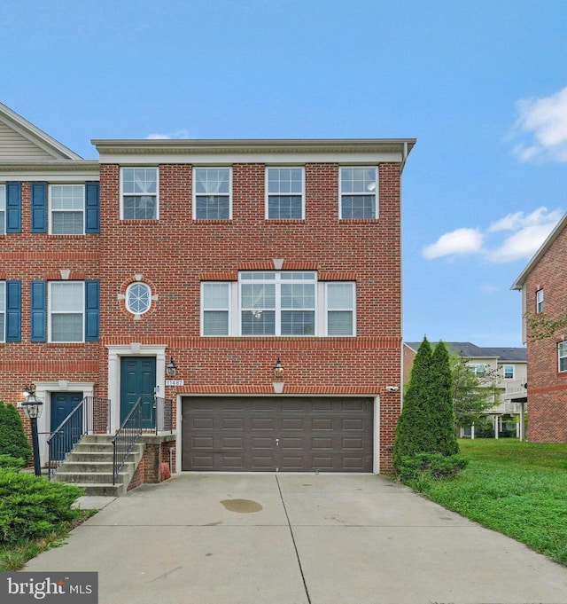 11487 Stockport Pl, White Plains, MD 20695 - view of property featuring an attached garage, brick siding, and concrete driveway