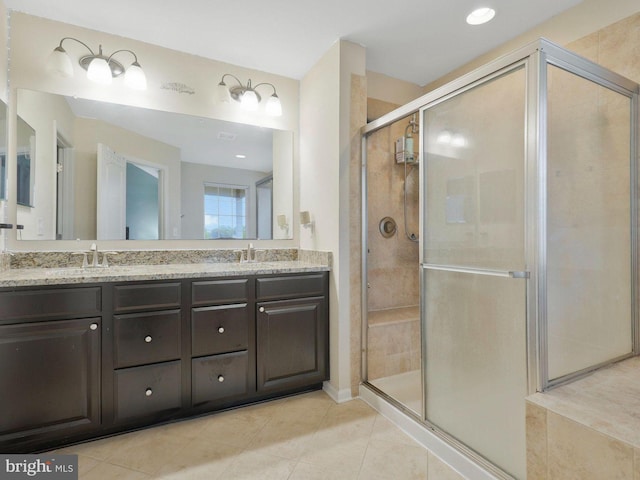 11487 Stockport Pl, White Plains, MD 20695 - full bathroom featuring double vanity, a sink, a stall shower, and tile patterned floors