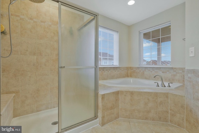 bathroom featuring independent shower and bath and tile patterned floors