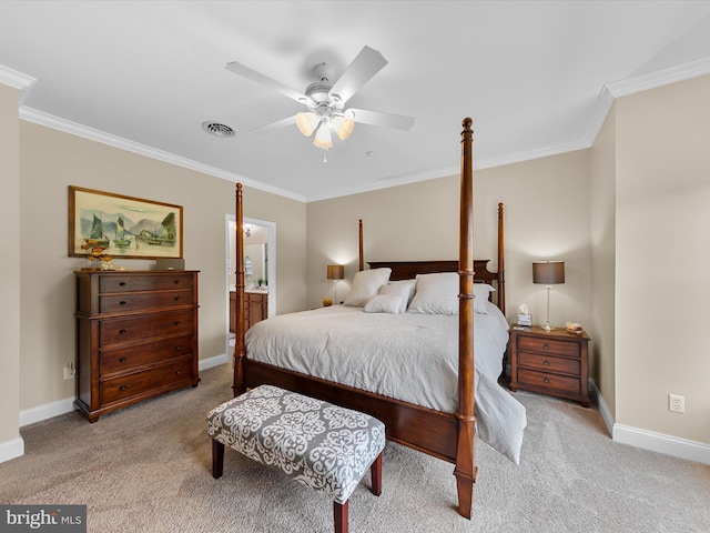 bedroom with crown molding, connected bathroom, ceiling fan, and light colored carpet