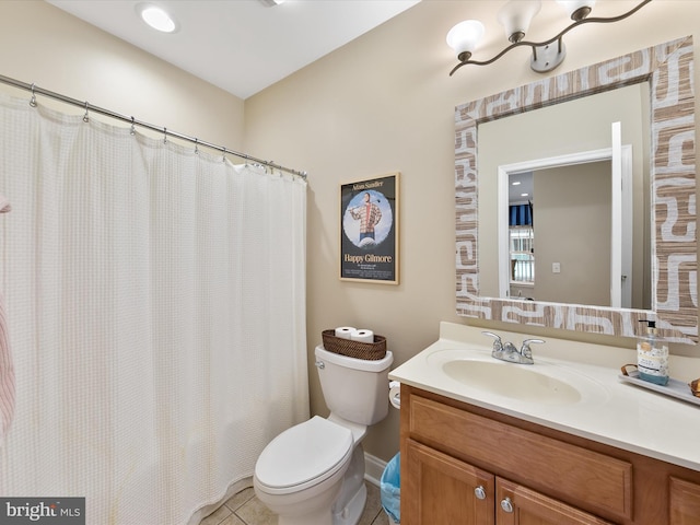 bathroom with tile patterned flooring, a shower with curtain, vanity, and toilet