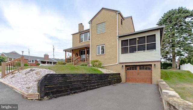 view of front facade featuring a garage and a porch