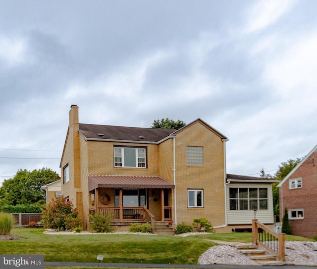 view of front of home with a front lawn and a porch