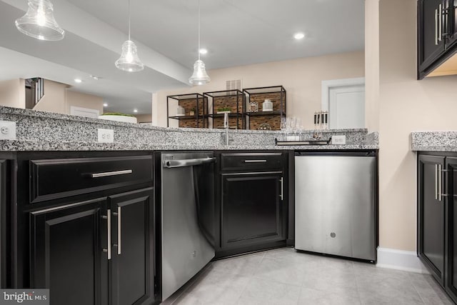 kitchen with light stone counters, hanging light fixtures, and dishwasher