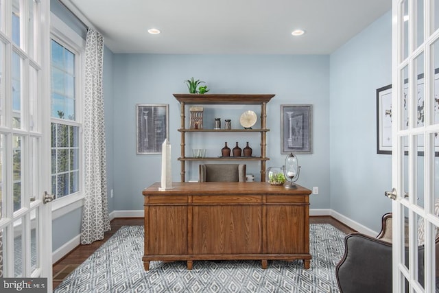 office area with light wood-type flooring and french doors