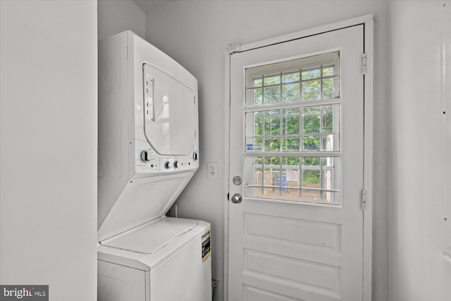 laundry area with stacked washer / dryer