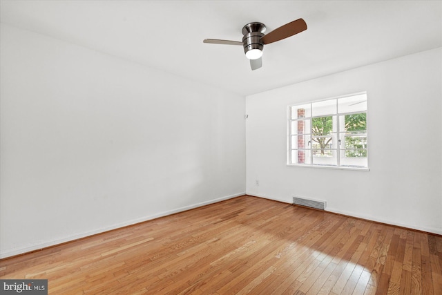 spare room with light hardwood / wood-style floors and ceiling fan