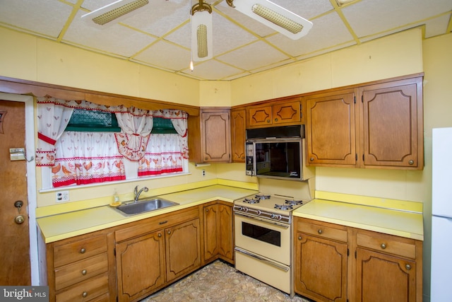 kitchen with sink and white appliances