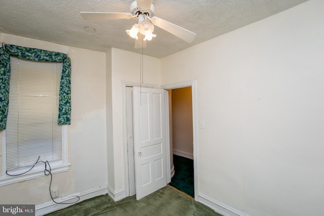 bedroom featuring ceiling fan, a textured ceiling, a closet, and carpet