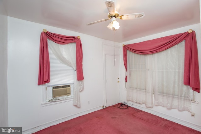 spare room with carpet floors, cooling unit, and ceiling fan