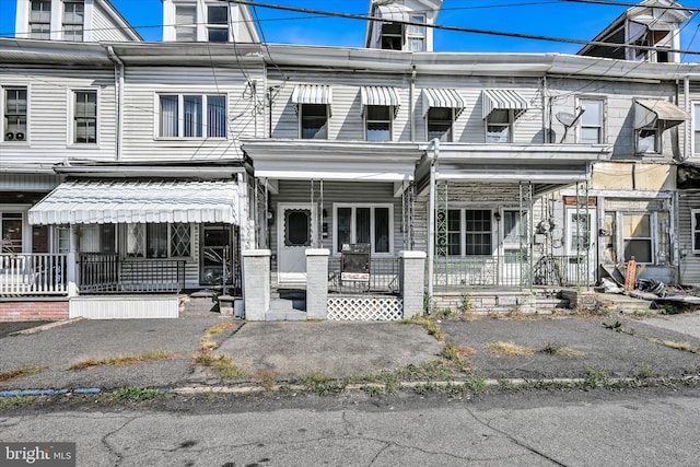 view of property featuring covered porch