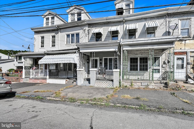 view of property with covered porch