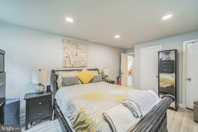 bedroom with light hardwood / wood-style flooring