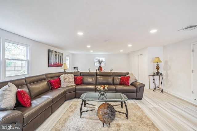 living room with light hardwood / wood-style flooring