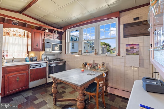 kitchen featuring vaulted ceiling with beams, sink, baseboard heating, dishwasher, and white range with gas cooktop