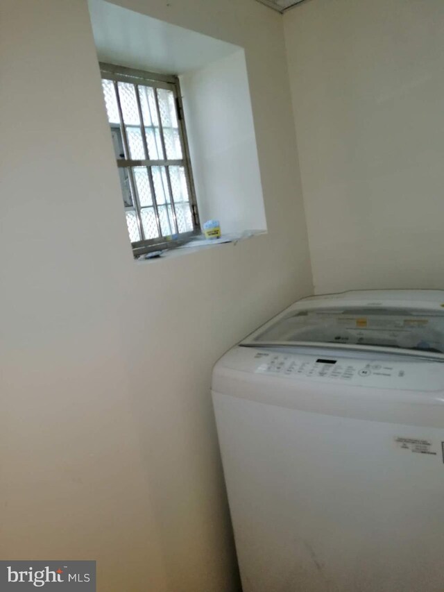 clothes washing area featuring washer / clothes dryer