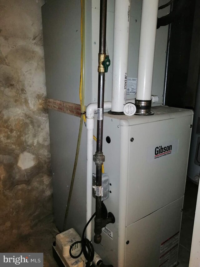 utility room with heating unit