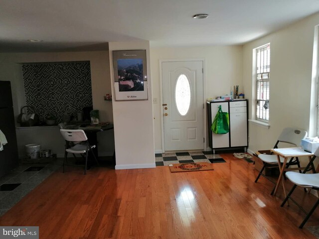 entryway with hardwood / wood-style floors