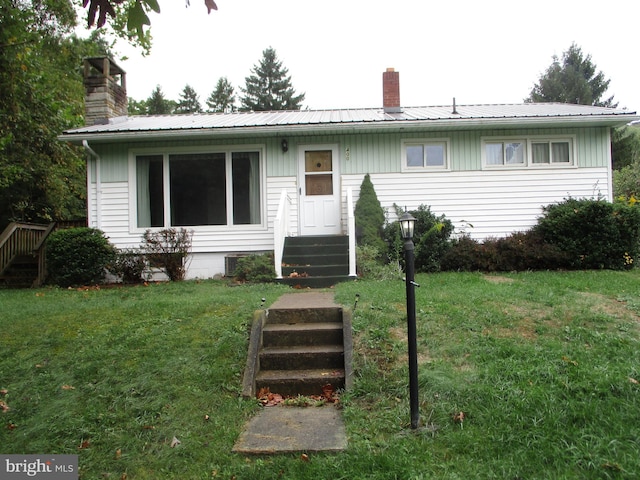 view of front of home with a front yard