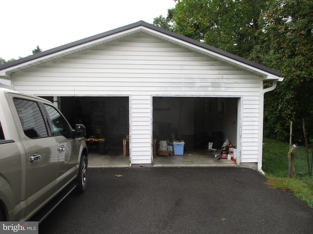 garage featuring wood walls