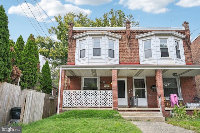 townhome / multi-family property with covered porch