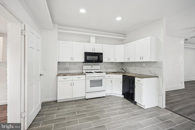 kitchen with light hardwood / wood-style flooring, white cabinets, black appliances, and sink