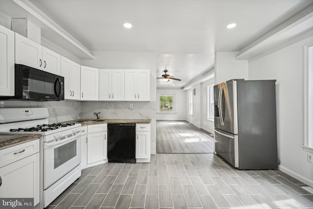 kitchen featuring black appliances, light hardwood / wood-style flooring, ceiling fan, and white cabinets