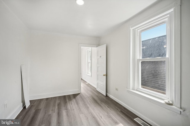 unfurnished bedroom featuring hardwood / wood-style flooring