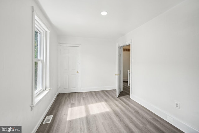 unfurnished room featuring light wood-type flooring